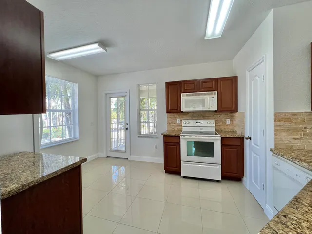 a kitchen with a stove and a microwave