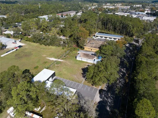 an aerial view of residential house with outdoor space