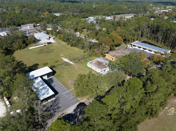 an aerial view of residential house with outdoor space