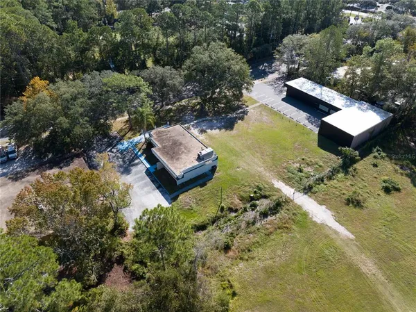 an aerial view of residential house with outdoor space