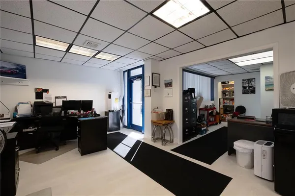 a bathroom with a sink toilet and a mirror