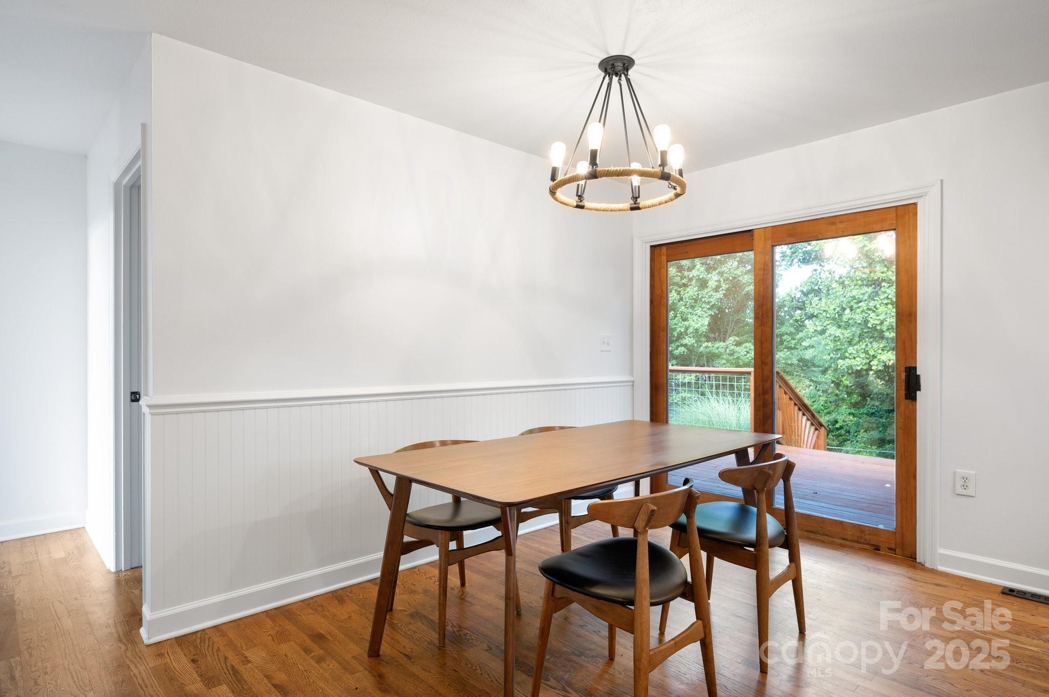 28 Spaulding Road Candler, NC 28715 - Photo 15 of 31 a view of a dining room with furniture window and wooden floor