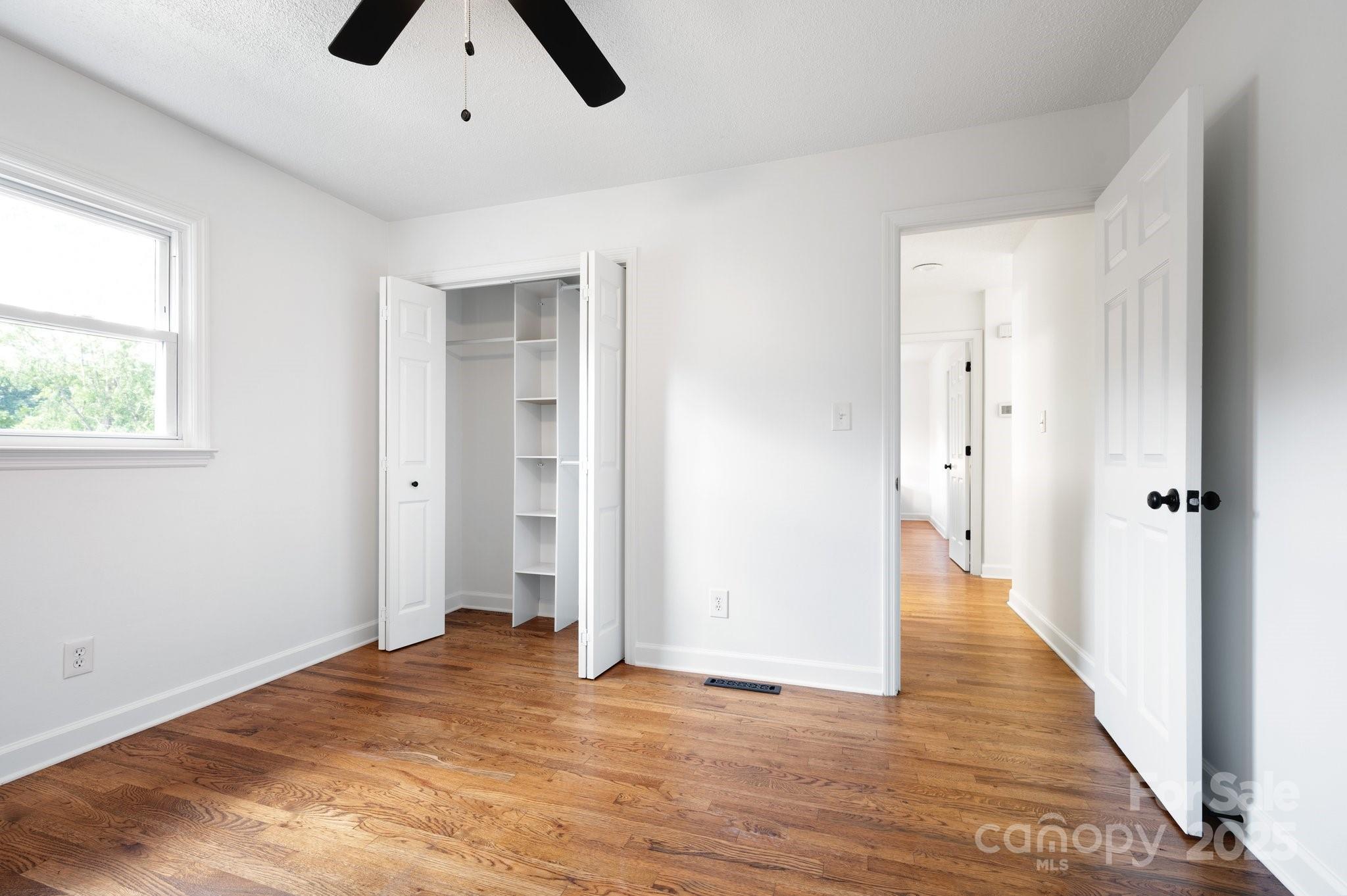 28 Spaulding Road Candler, NC 28715 - Photo 23 of 31 an empty room with closet and windows