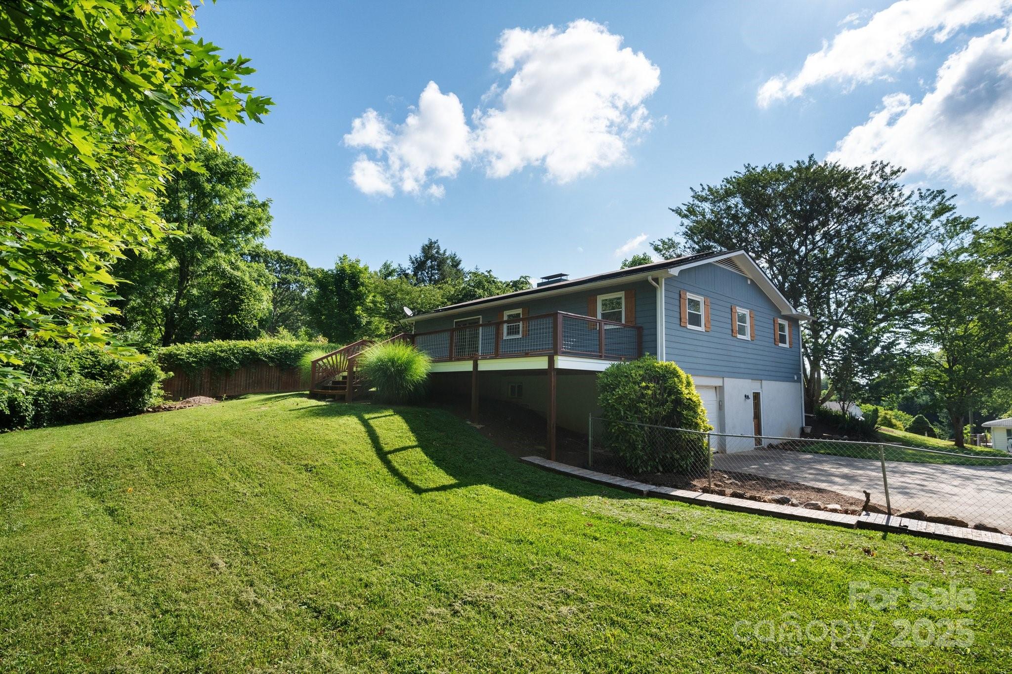 28 Spaulding Road Candler, NC 28715 - Photo 25 of 31 a front view of a house with garden