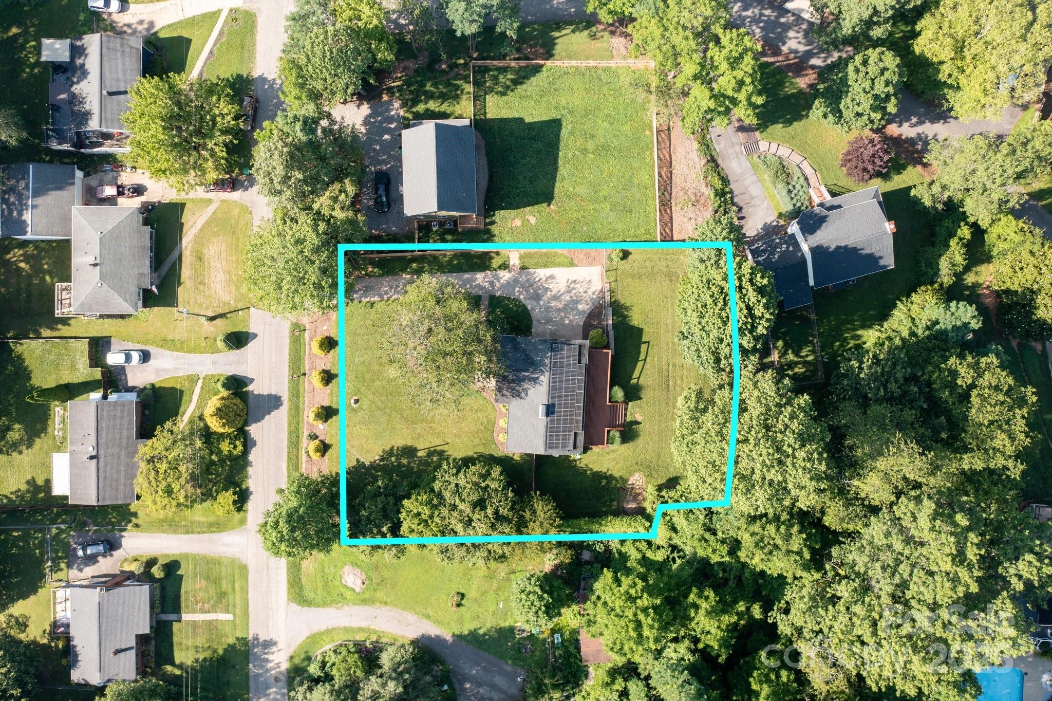 28 Spaulding Road Candler, NC 28715 - Photo 30 of 31 an aerial view of a house with a yard basket ball court and outdoor seating