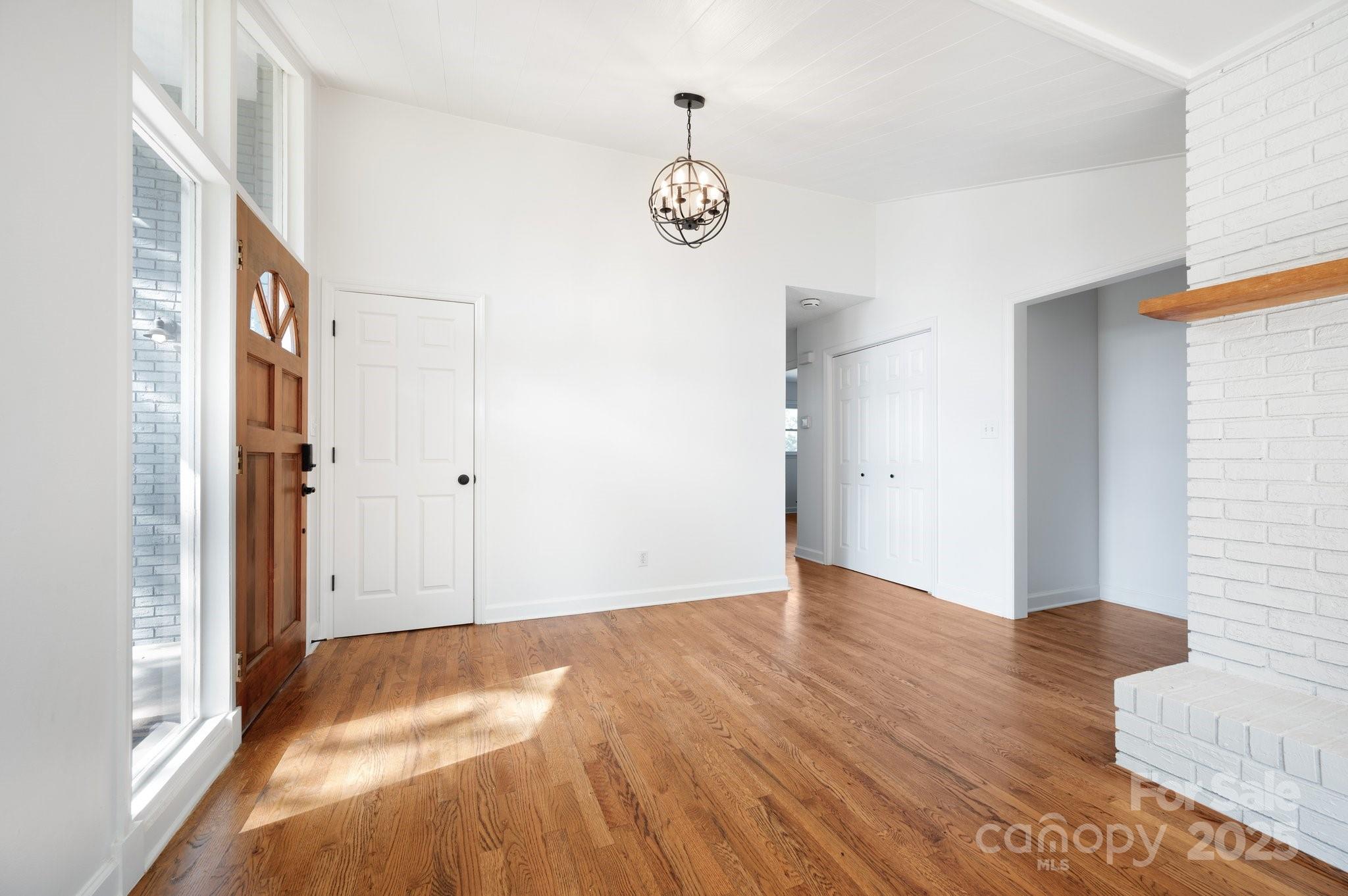 28 Spaulding Road Candler, NC 28715 - Photo 8 of 31 a view of an empty room with wooden floor and a window