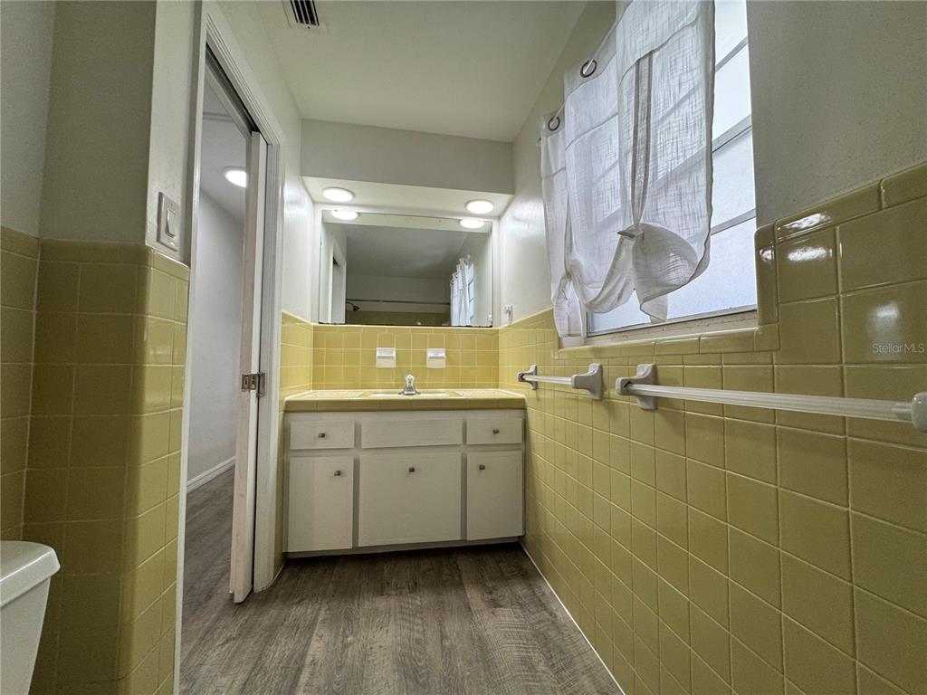 629 Rugby Street Orlando, FL 32804 - Photo 12 of 19 a bathroom with a sink a toilet and shower