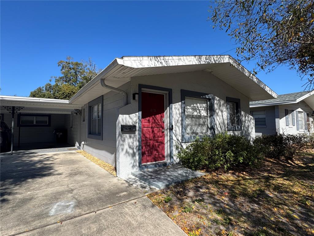 629 Rugby Street Orlando, FL 32804 - Photo 18 of 19 a view of a house with entryway and a yard