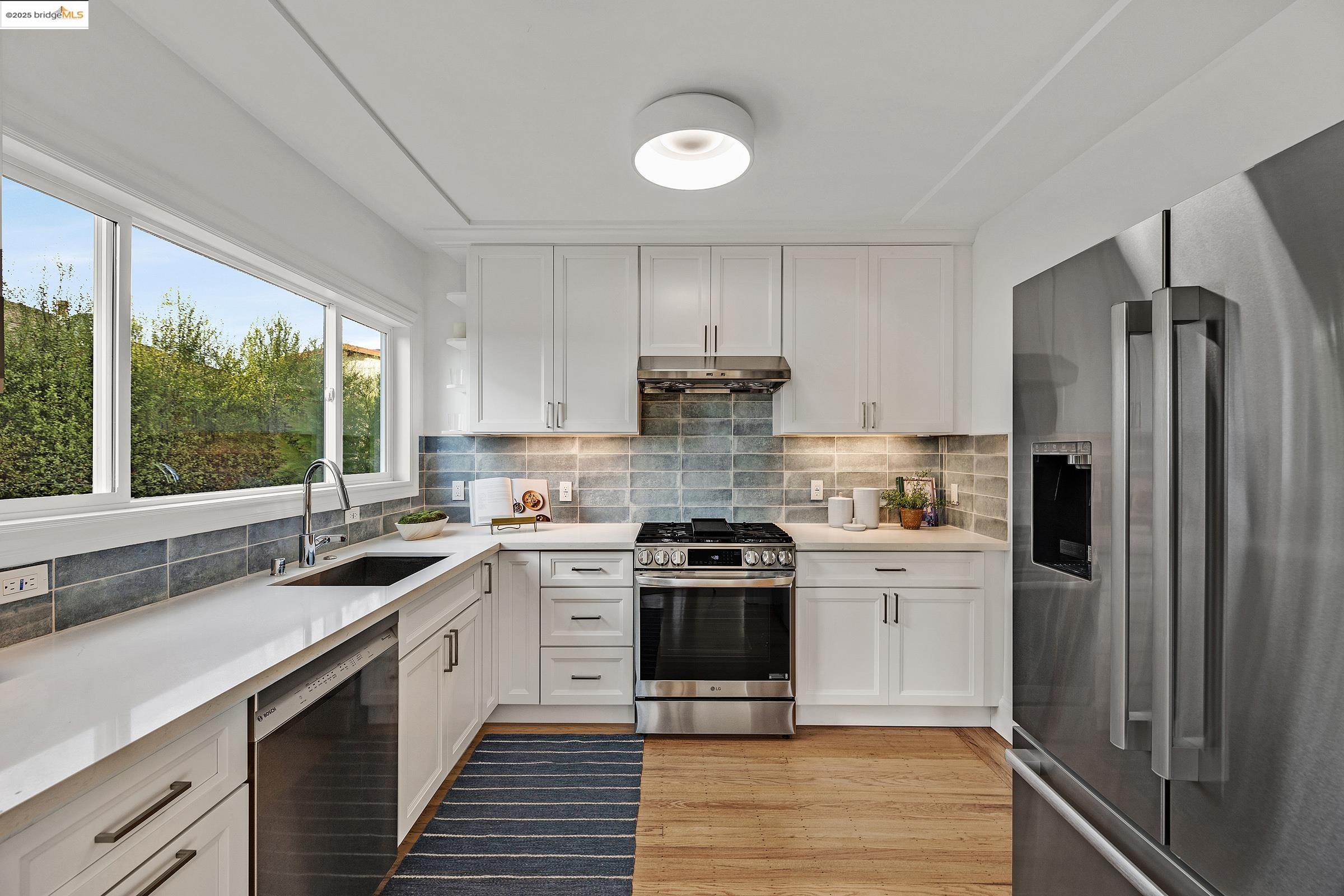 1515 Derby Street Berkeley, CA 94703 - Photo 14 of 60 a kitchen with a sink stove and refrigerator
