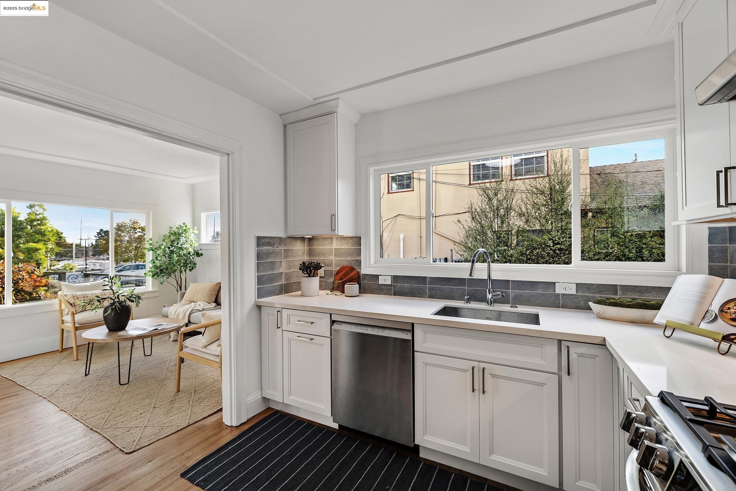1515 Derby Street Berkeley, CA 94703 - Photo 17 of 60 a kitchen with a sink stove and cabinets