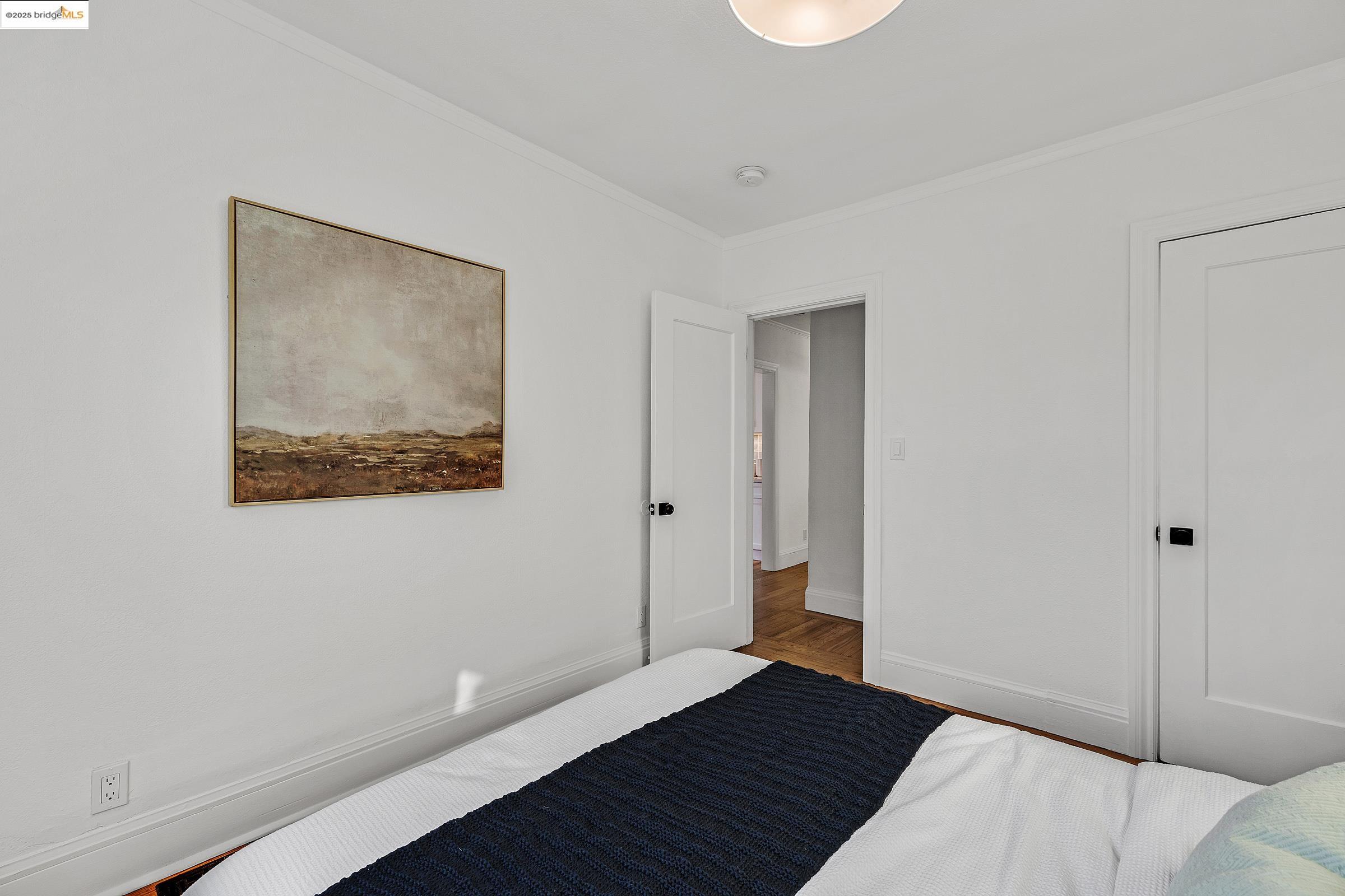 1515 Derby Street Berkeley, CA 94703 - Photo 21 of 60 a view of a bedroom with wooden floor
