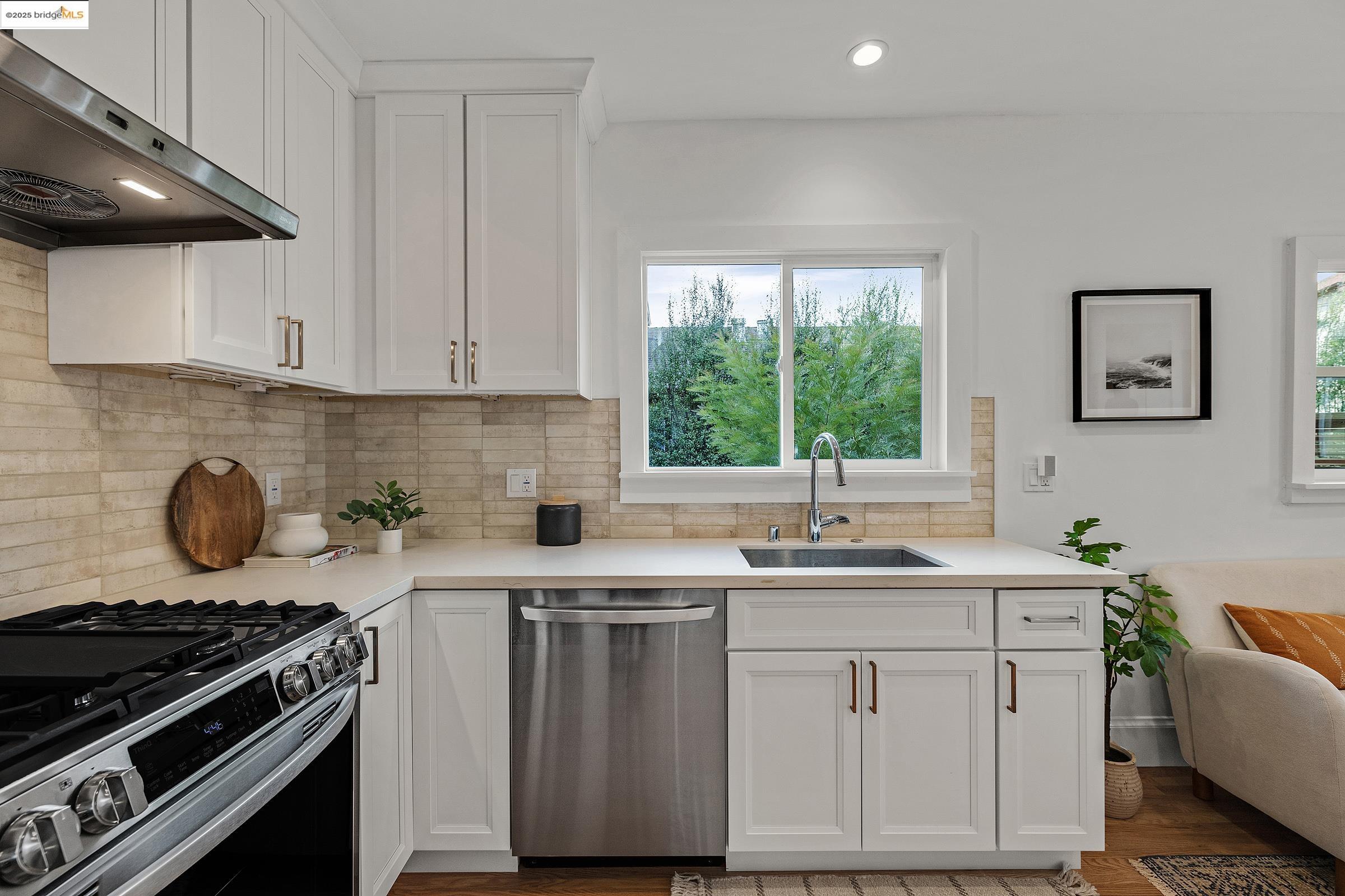 1515 Derby Street Berkeley, CA 94703 - Photo 45 of 60 a kitchen with a sink stove and cabinets