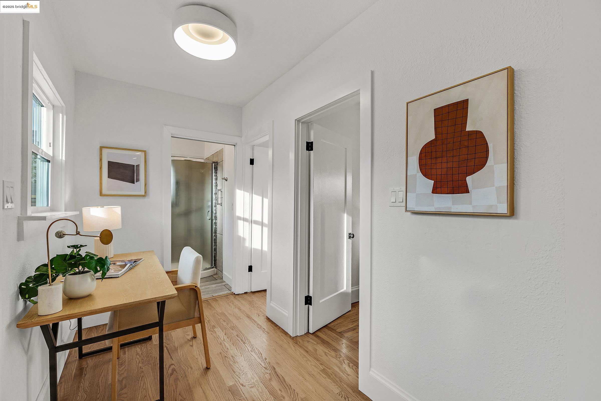 1515 Derby Street Berkeley, CA 94703 - Photo 46 of 60 a view of a hallway with wooden floor and furniture