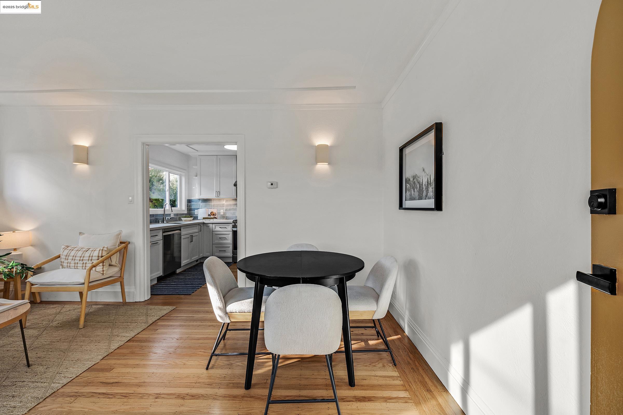 1515 Derby Street Berkeley, CA 94703 - Photo 6 of 60 a view of a dining room with furniture and wooden floor