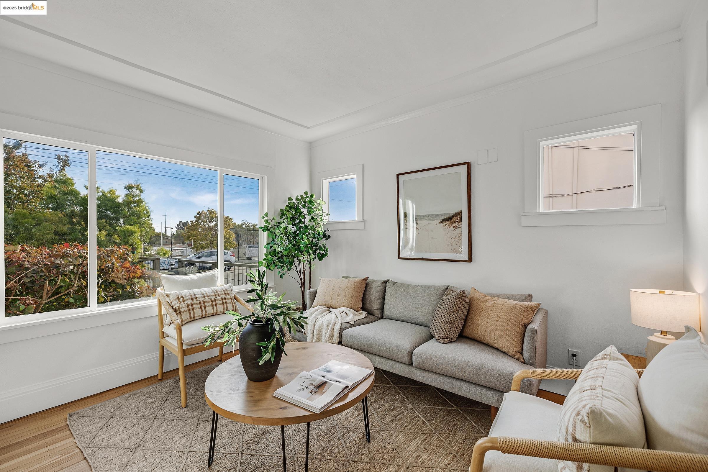 1515 Derby Street Berkeley, CA 94703 - Photo 9 of 60 a living room with furniture and a potted plant