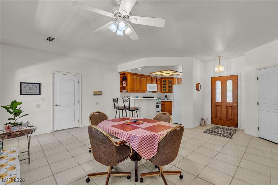 825 West Ryan Avenue Overton, NV 89040 - Photo 22 of 88 Dining area with light tile patterned flooring and a ceiling fan