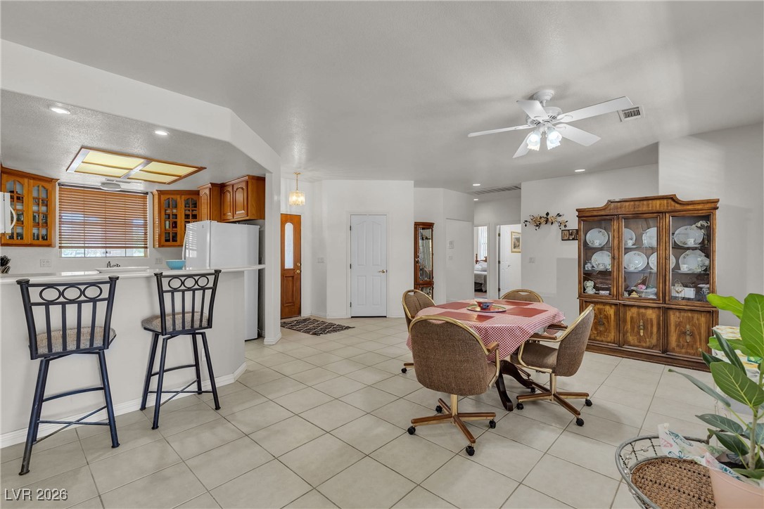 825 West Ryan Avenue Overton, NV 89040 - Photo 23 of 88 Dining room with recessed lighting, light tile patterned floors, and ceiling fan