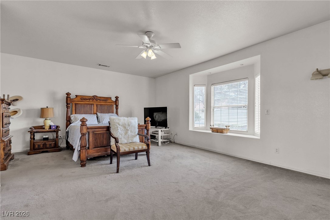 825 West Ryan Avenue Overton, NV 89040 - Photo 28 of 88 Carpeted bedroom featuring a ceiling fan and baseboards