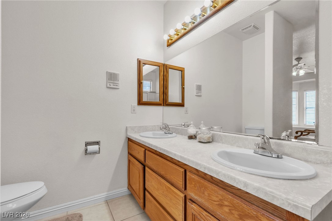 825 West Ryan Avenue Overton, NV 89040 - Photo 32 of 88 Bathroom featuring double vanity, tile patterned floors, and a ceiling fan