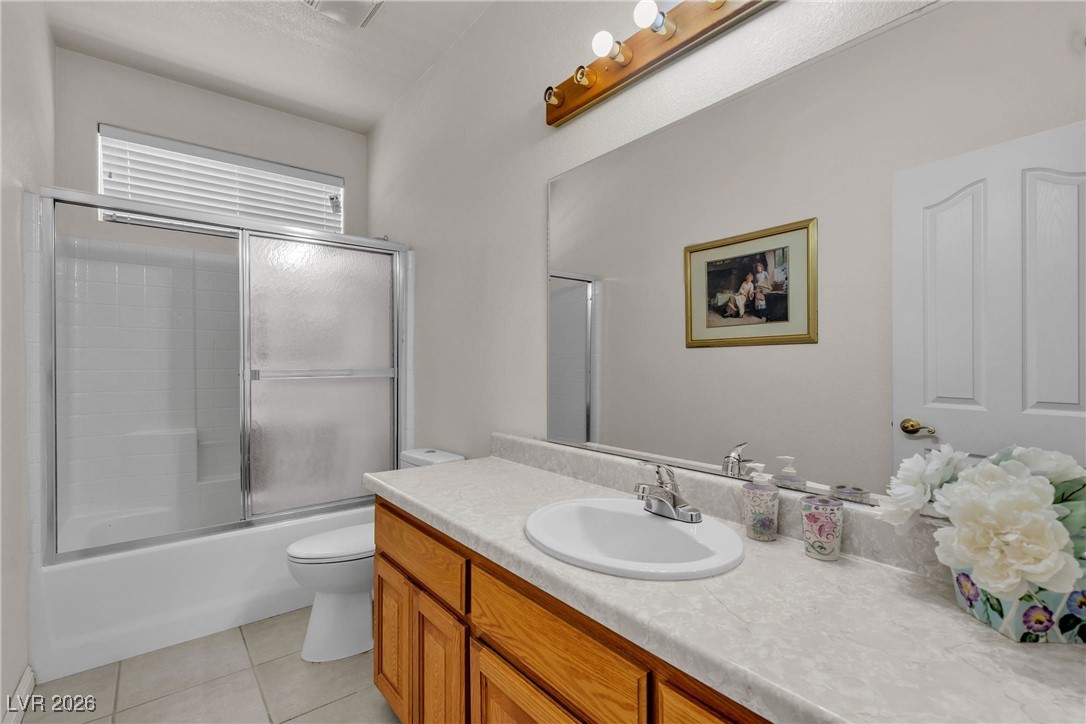 825 West Ryan Avenue Overton, NV 89040 - Photo 37 of 88 Bathroom with vanity, tile patterned floors, and combined bath / shower with glass door