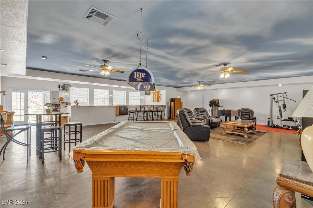 825 West Ryan Avenue Overton, NV 89040 - Photo 43 of 88 Rec room with a ceiling fan, billiards, finished concrete floors, and an entertainment bar