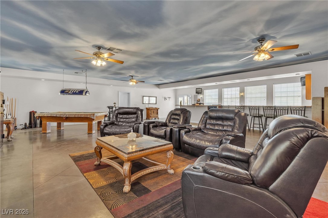 825 West Ryan Avenue Overton, NV 89040 - Photo 44 of 88 Living room featuring ceiling fan, finished concrete flooring, and billiards