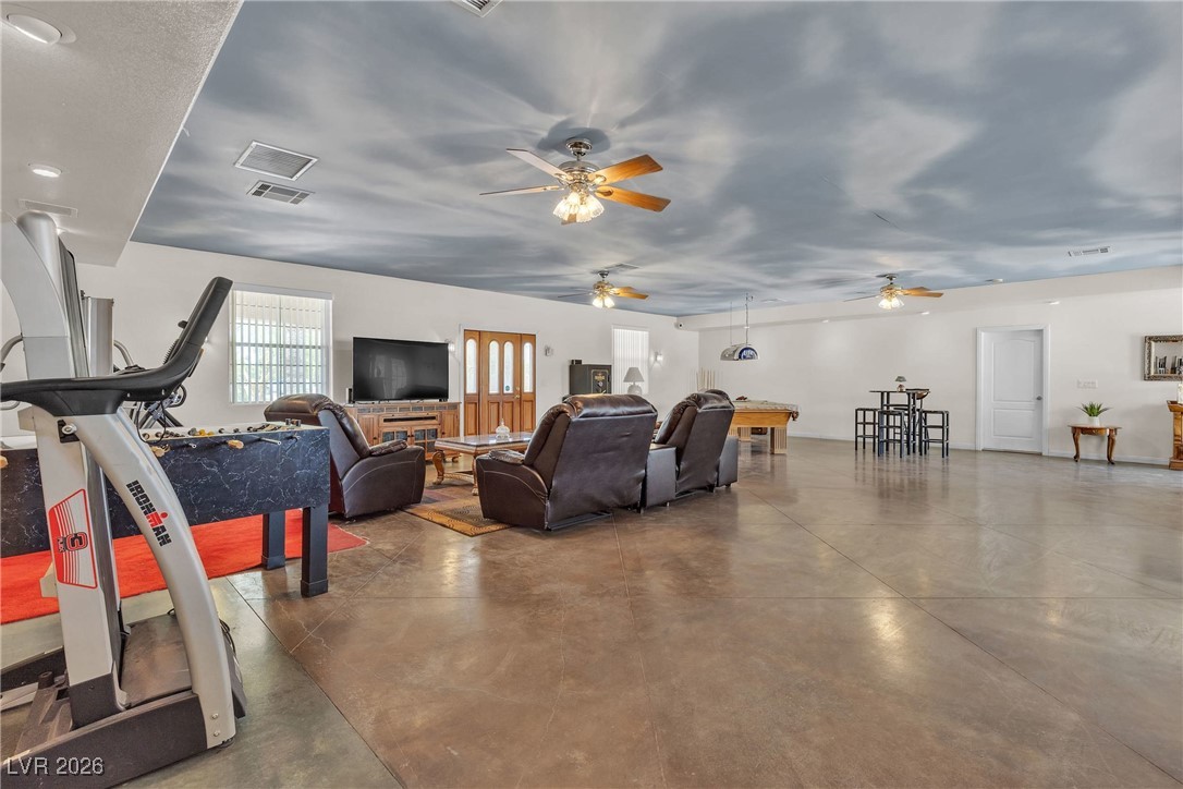 825 West Ryan Avenue Overton, NV 89040 - Photo 45 of 88 Living room with finished concrete floors and ceiling fan