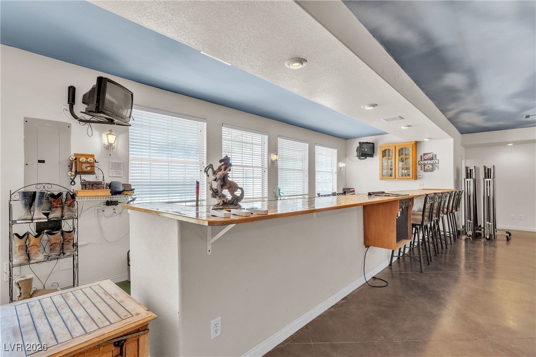 825 West Ryan Avenue Overton, NV 89040 - Photo 48 of 88 Wet bar area featuring electric panel, finished concrete floors, and an entertainment bar