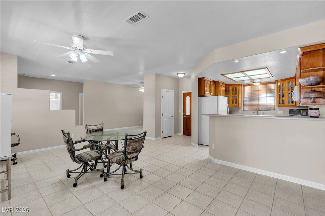 825 West Ryan Avenue Overton, NV 89040 - Photo 54 of 88 Dining room featuring a ceiling fan, light tile patterned floors, and recessed lighting