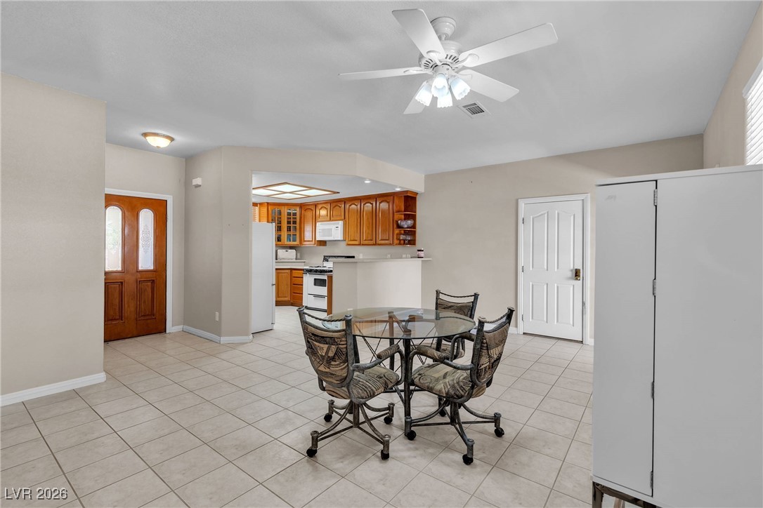 825 West Ryan Avenue Overton, NV 89040 - Photo 55 of 88 Dining room with light tile patterned flooring and a ceiling fan