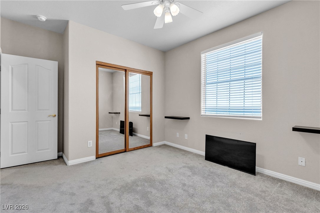 825 West Ryan Avenue Overton, NV 89040 - Photo 64 of 88 Unfurnished bedroom featuring carpet flooring, a closet, and ceiling fan