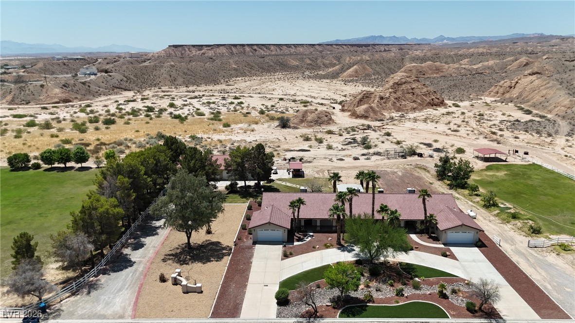 825 West Ryan Avenue Overton, NV 89040 - Photo 78 of 88 Aerial view of property, featuring a circular driveway with a mountain backdrop