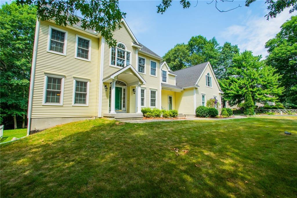 a front view of a house with a yard