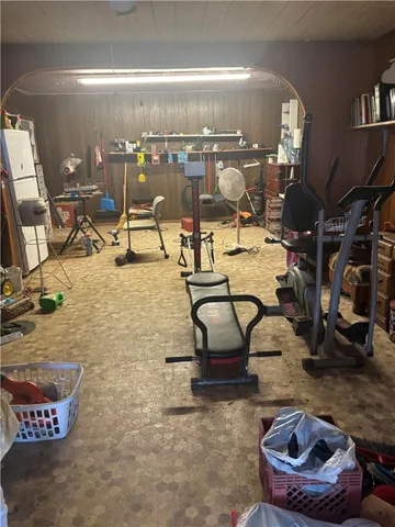 a kitchen area with granite countertop a refrigerator and a stove