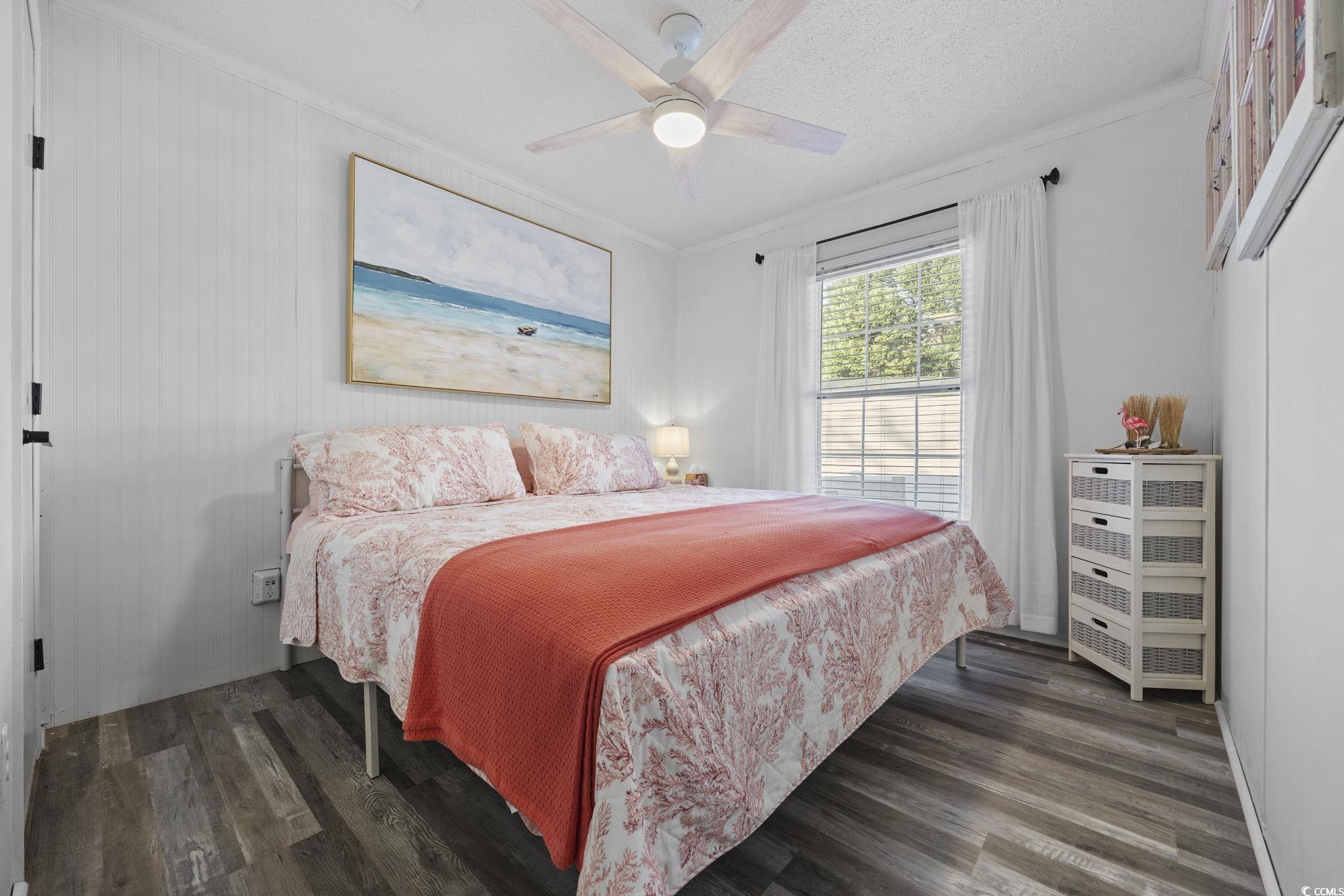 944 Pine Thicket Street Myrtle Beach, SC 29577 - Photo 16 of 27 Bedroom with crown molding, dark wood finished floors, ceiling fan, and a textured ceiling