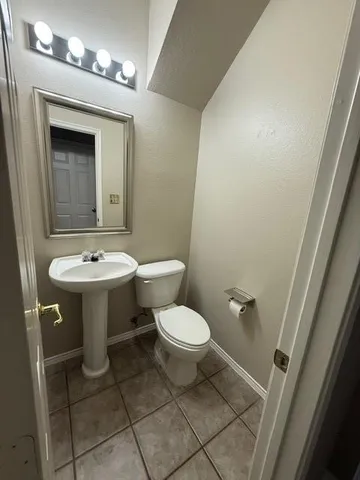 a view of a livingroom with stairs