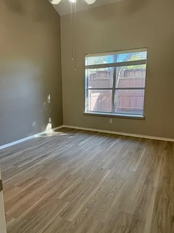 wooden floor and window in an empty room