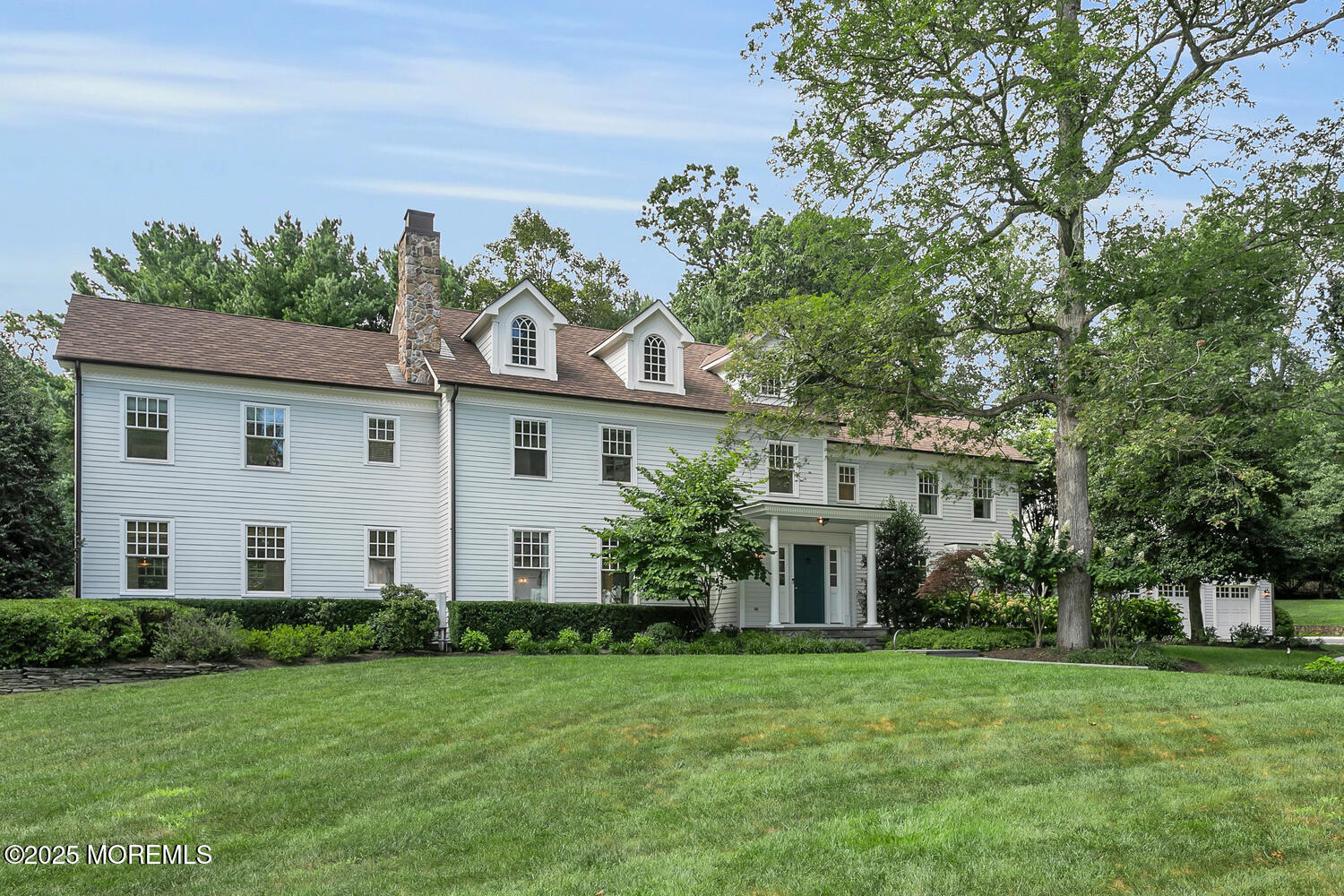 front view of a house with a garden