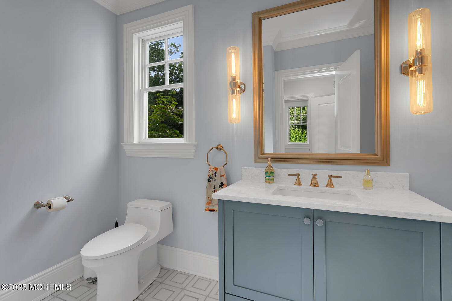 10 Edgewood Road Rumson, NJ 07760 - Photo 12 of 43 a bathroom with a toilet sink and mirror