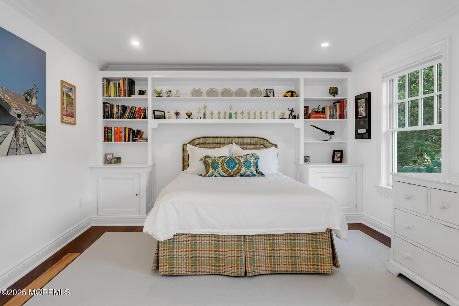 10 Edgewood Road Rumson, NJ 07760 - Photo 19 of 43 a bedroom with a bed and a book shelf