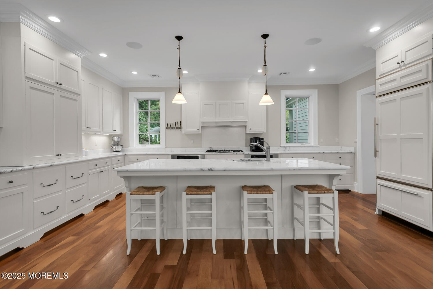 10 Edgewood Road Rumson, NJ 07760 - Photo 2 of 43 a kitchen with stainless steel appliances granite countertop a stove a sink dishwasher a refrigerator and white cabinets with wooden floor