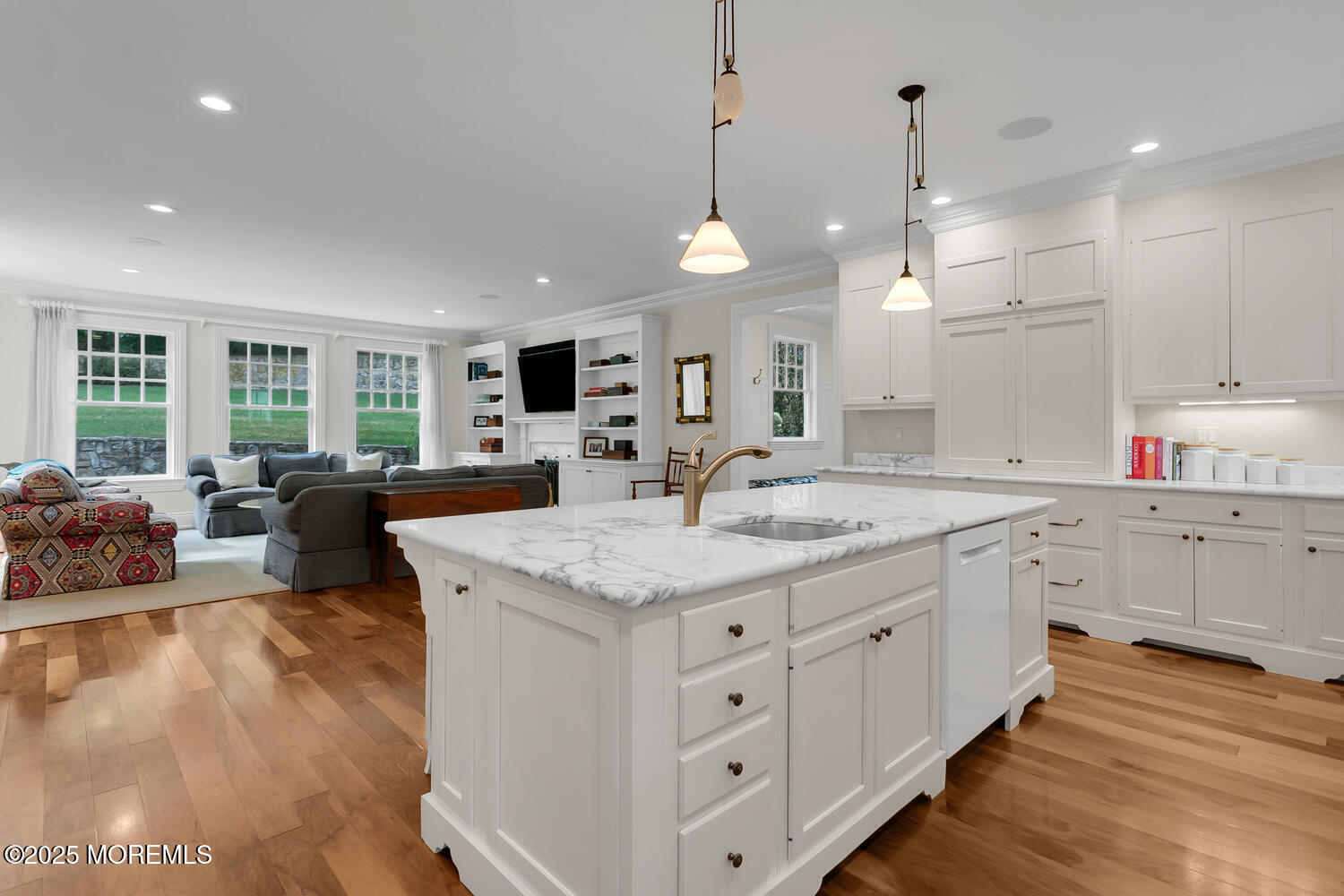 10 Edgewood Road Rumson, NJ 07760 - Photo 43 of 43 a large kitchen with kitchen island a large center island white cabinets and stainless steel appliances