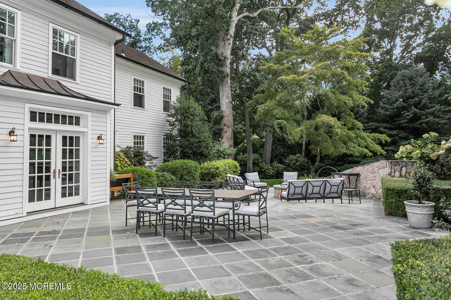 10 Edgewood Road Rumson, NJ 07760 - Photo 38 of 43 a view of a patio with a chairs and table potted plants