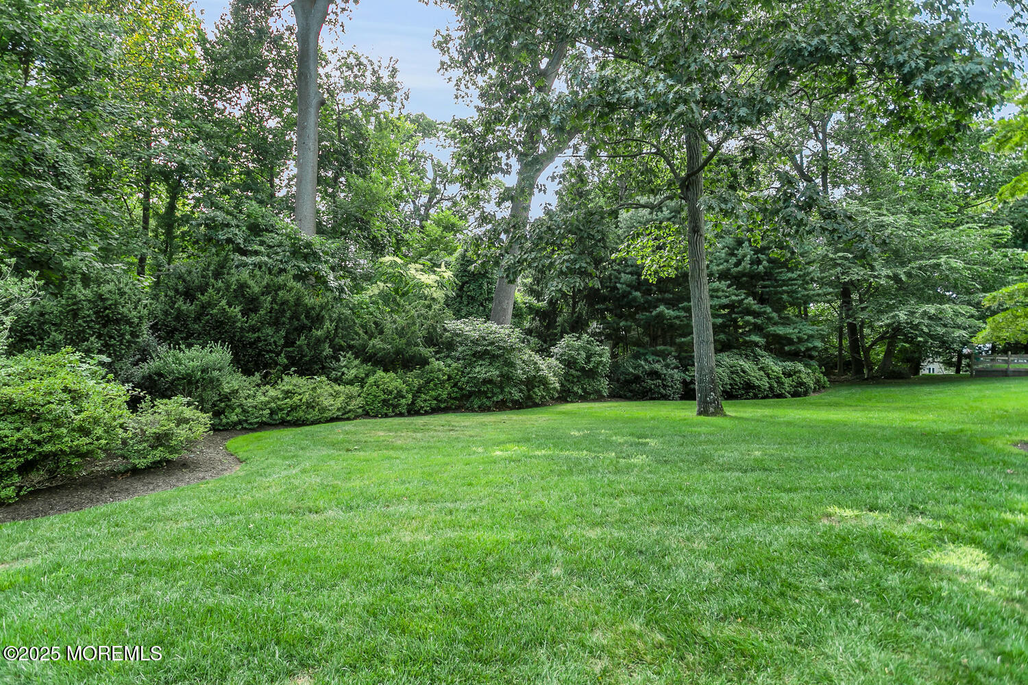 10 Edgewood Road Rumson, NJ 07760 - Photo 39 of 43 a view of a grassy field with trees in the background