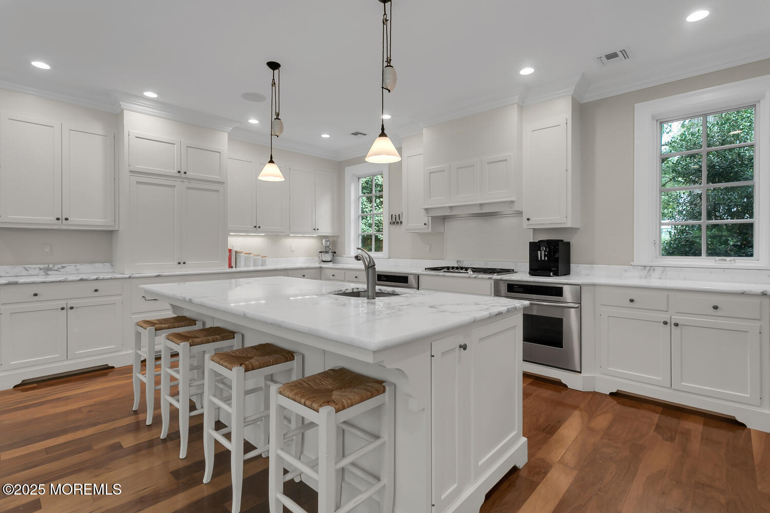 10 Edgewood Road Rumson, NJ 07760 - Photo 3 of 43 a kitchen with white cabinets and appliances