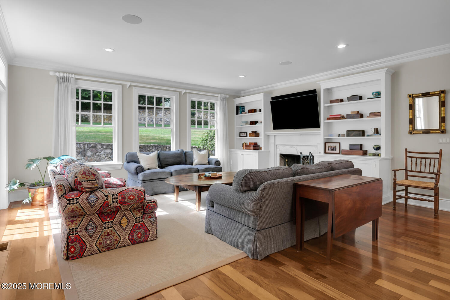 10 Edgewood Road Rumson, NJ 07760 - Photo 4 of 43 a living room with furniture a flat screen tv and a large window
