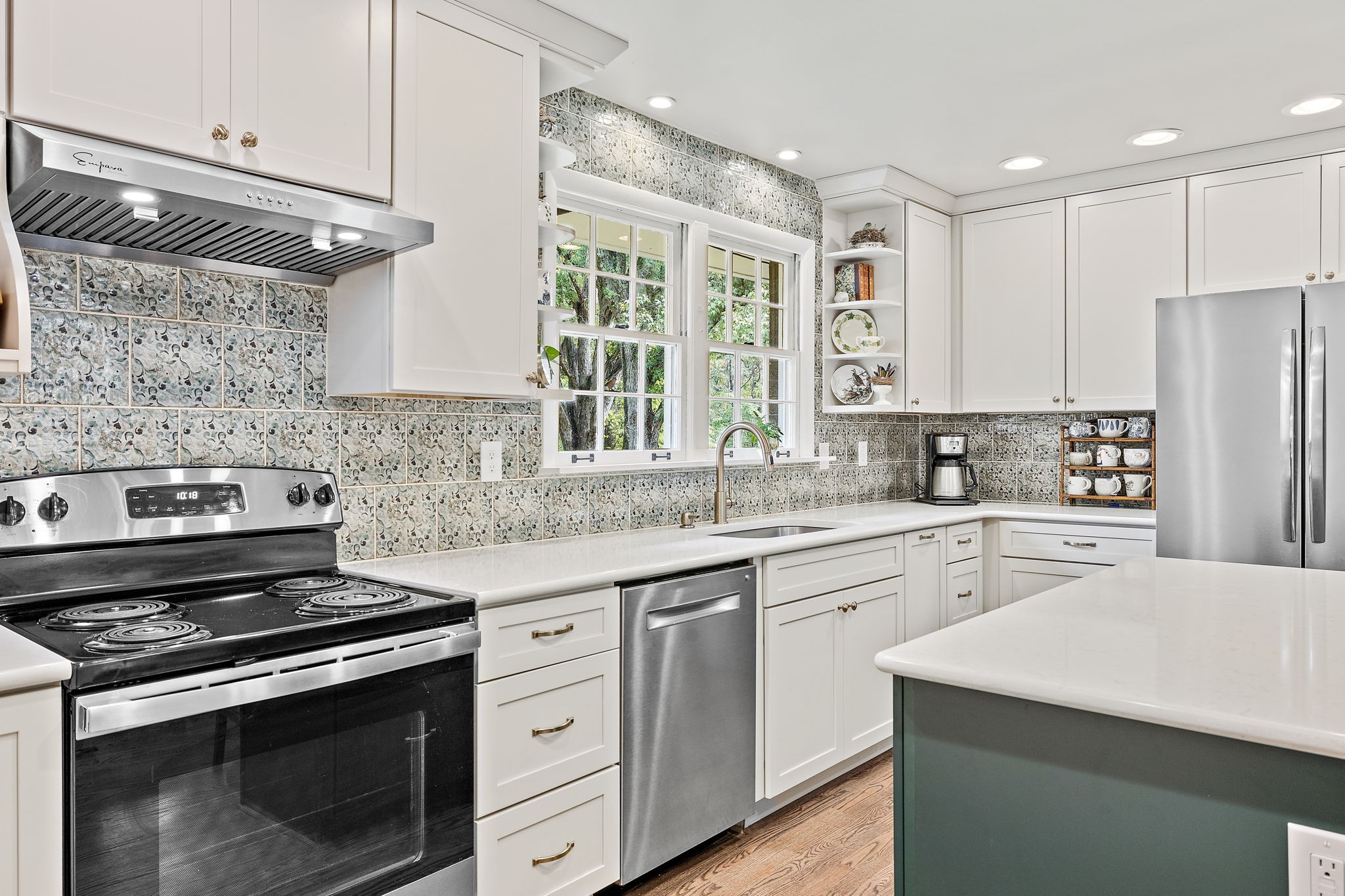 7767 Fernvale Road Fairview, TN 37062 - Photo 27 of 70 a kitchen with stainless steel appliances a stove sink and cabinets