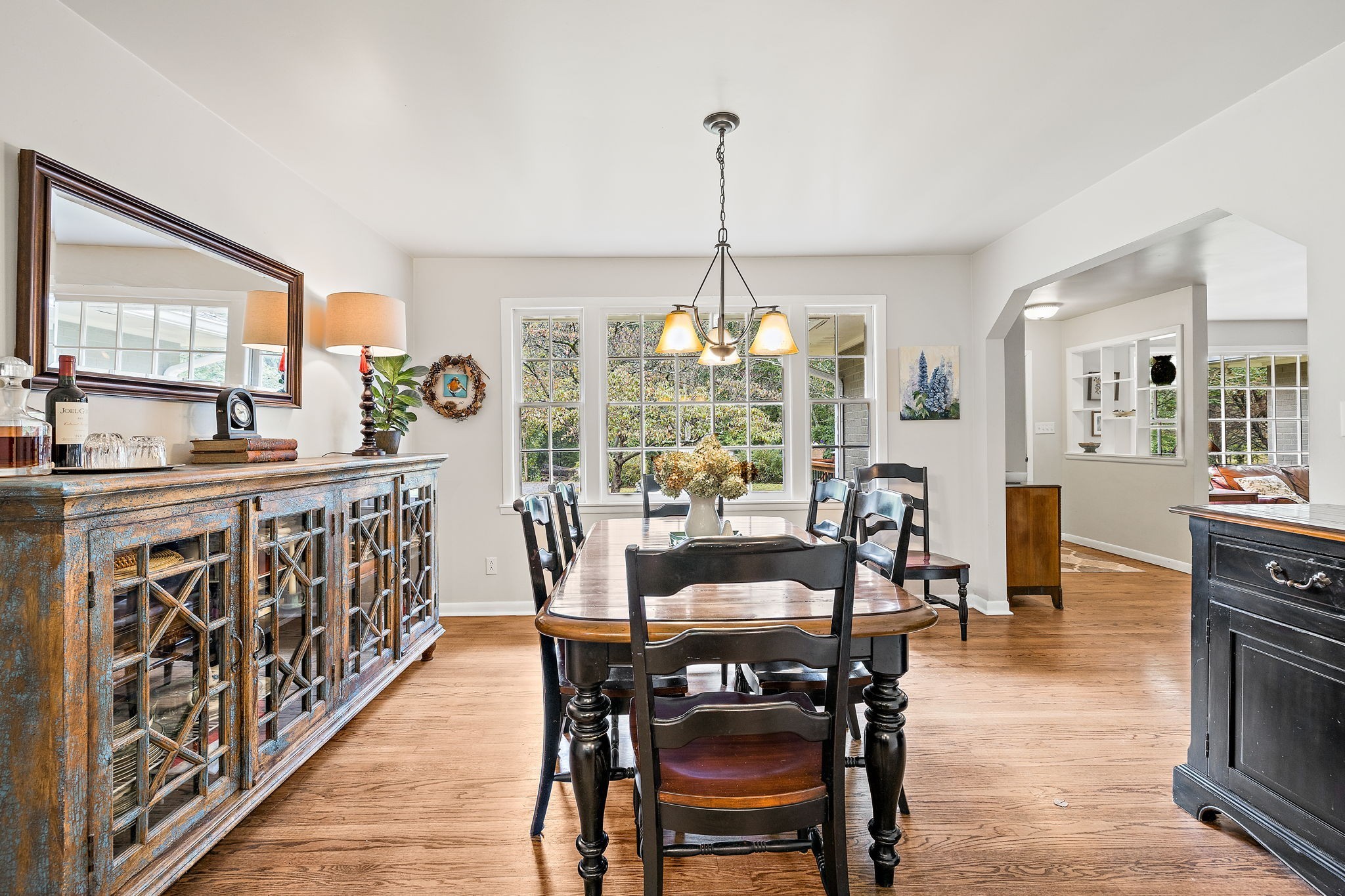 7767 Fernvale Road Fairview, TN 37062 - Photo 31 of 70 a view of a dining room and livingroom with furniture wooden floor a chandelier