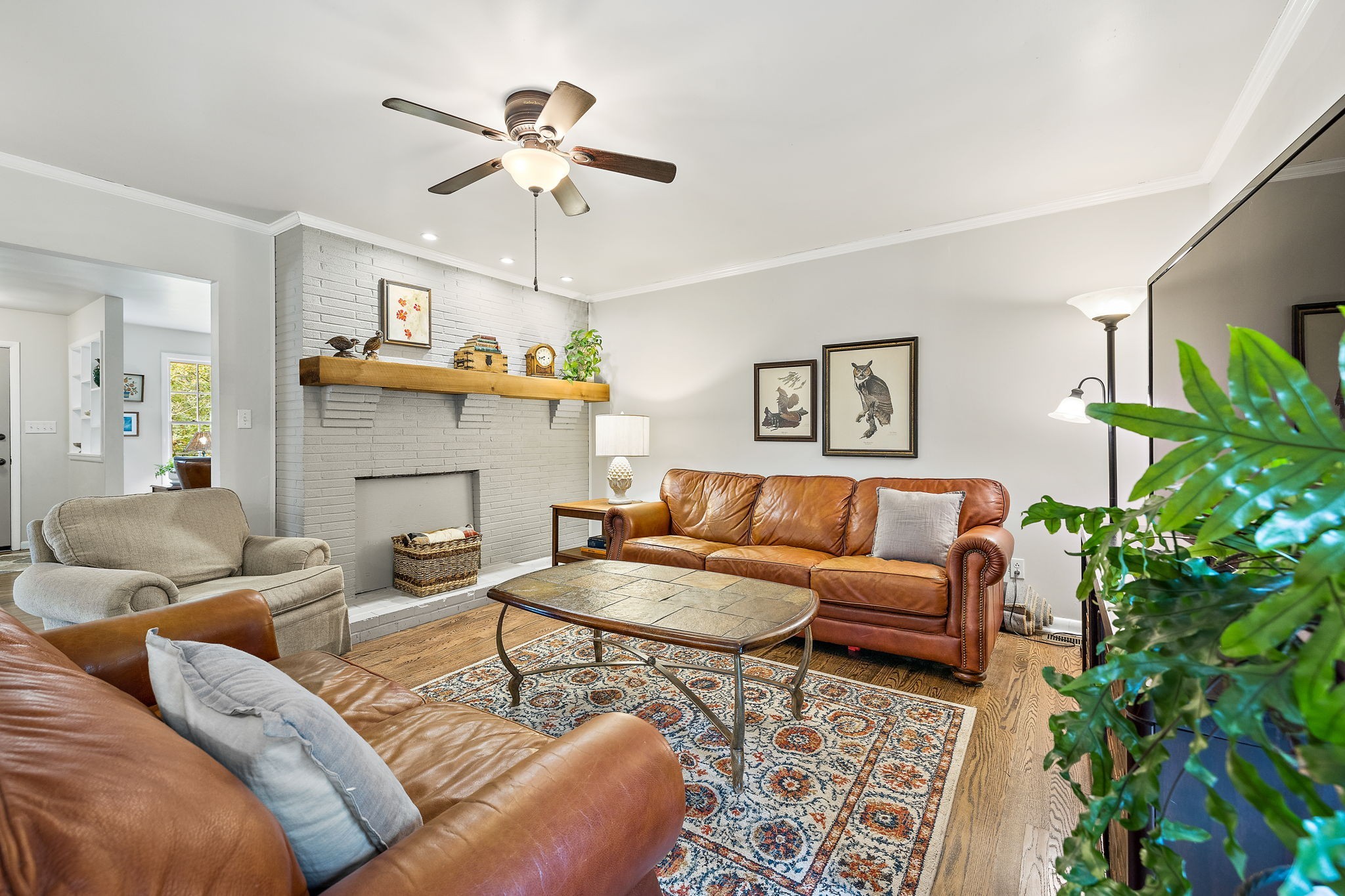 7767 Fernvale Road Fairview, TN 37062 - Photo 35 of 70 a living room with furniture a chandelier and a potted plant