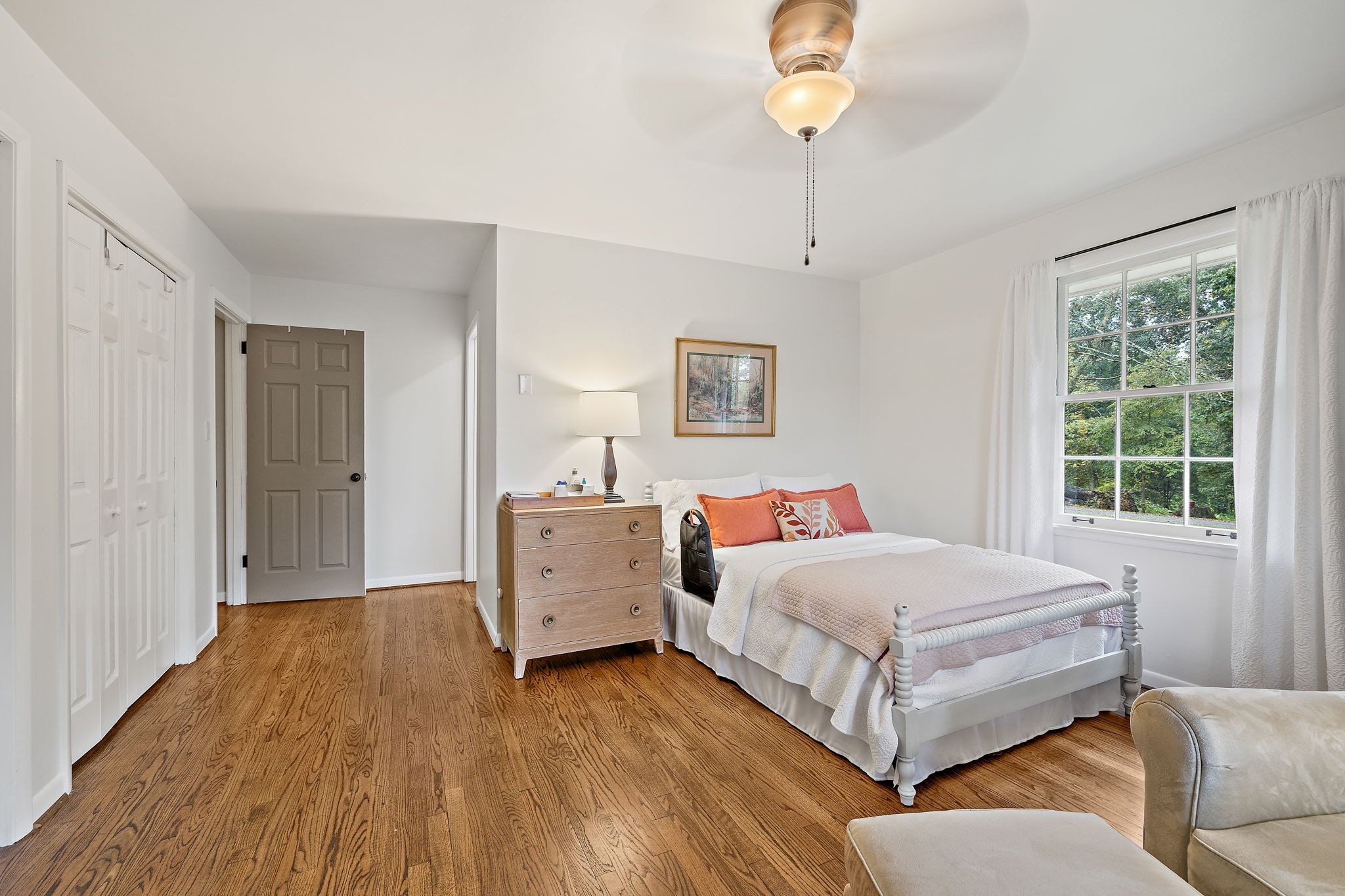 7767 Fernvale Road Fairview, TN 37062 - Photo 38 of 70 a bedroom with a bed and a chandelier